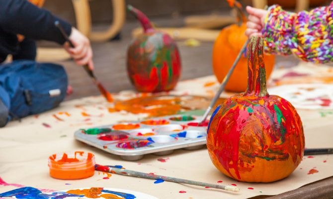 Get messy with a pumpkin decorating party!
